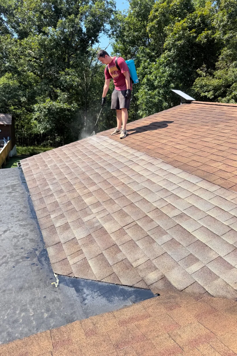 Roof rejuvenation treatment in progress on a home in Lucasville, Ohio β treated shingles next to untreated